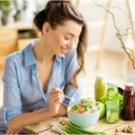 beautiful-woman-sitting-healthy-green-food_big