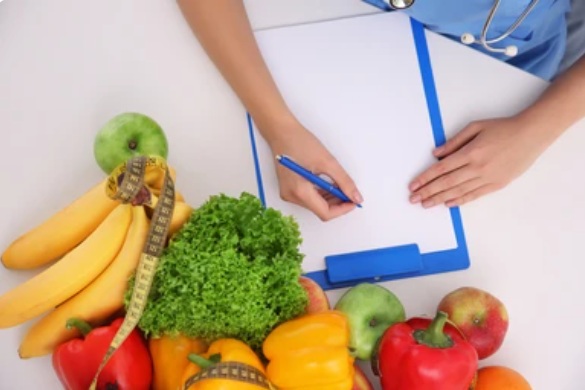 nutritionist-doctor-writing-diet-plan-on